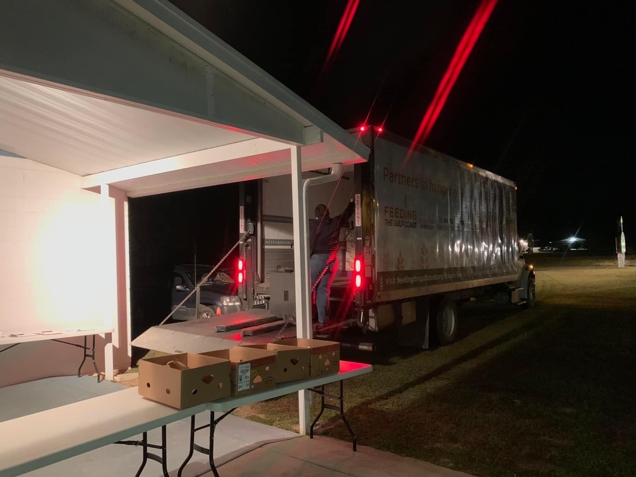 Volunteers unloading food deliveries for the Jay, Florida community.